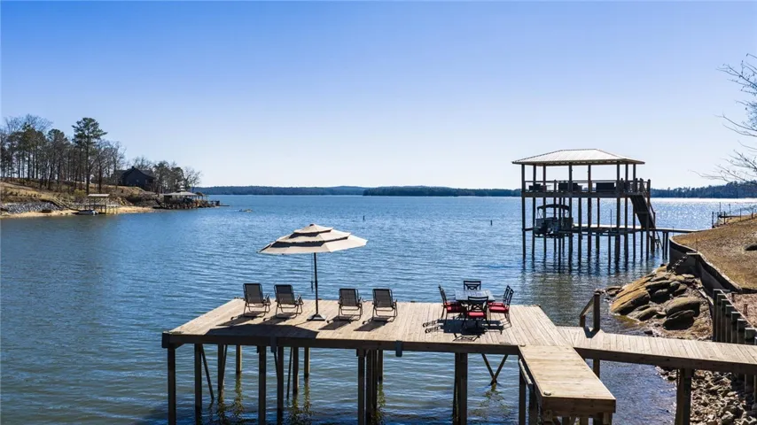 This tranquil lakeside retreat offers a private dock for effortless waterfront living and recreation.