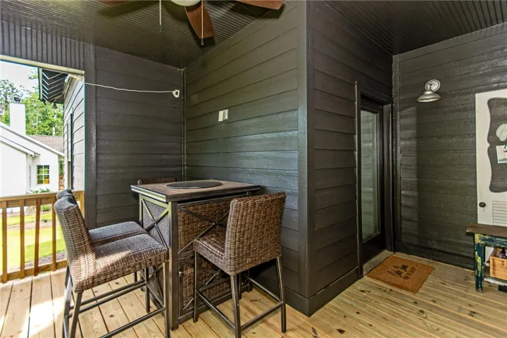 This inviting porch area offers a delightful space for relaxation and enjoying the outdoors.