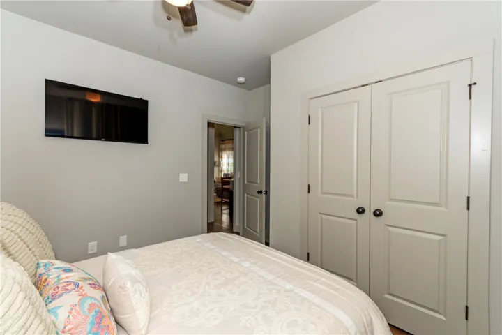 This cozy bedroom provides a comfortable retreat with ample storage.