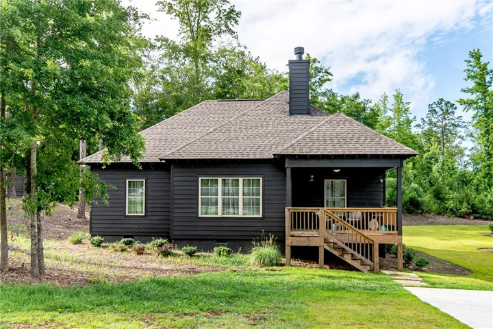 This charming home offers a serene escape, blending comfort with nature's beauty.