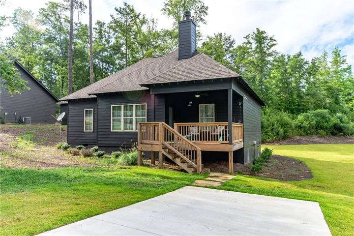 This charming home offers a serene escape, blending comfort with nature's beauty and outdoor living.