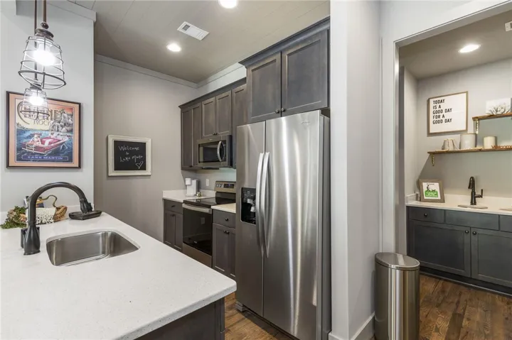 This functional kitchen features stainless steel appliances and ample counter space for daily living.