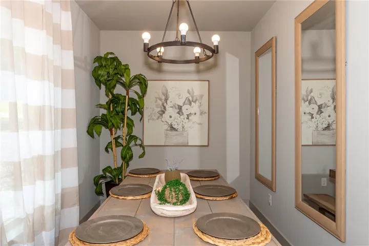 This inviting dining area features ample natural light, perfect for gatherings.