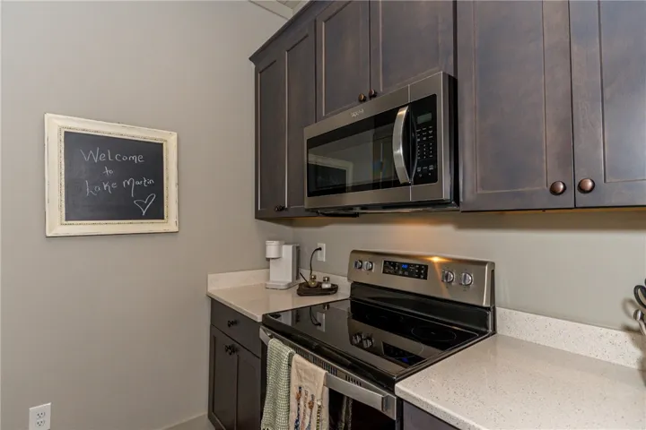 This compact culinary space combines functionality with modern style.