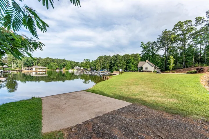 This peaceful lakefront property offers convenient water access with a private boat ramp.