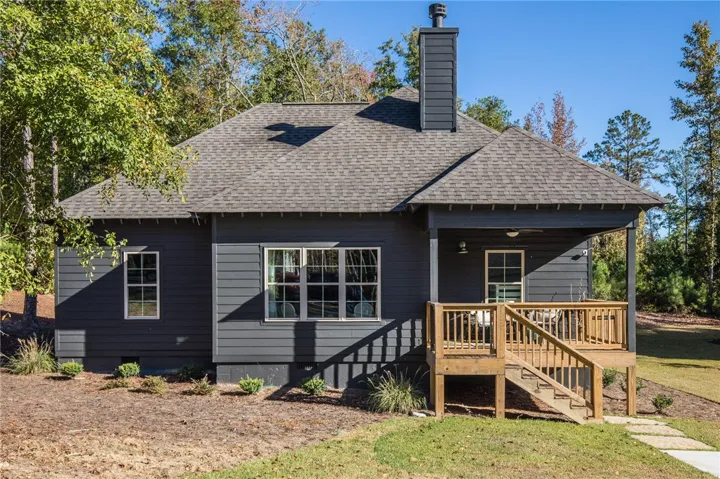 This charming home features a welcoming covered porch, perfect for outdoor relaxation.