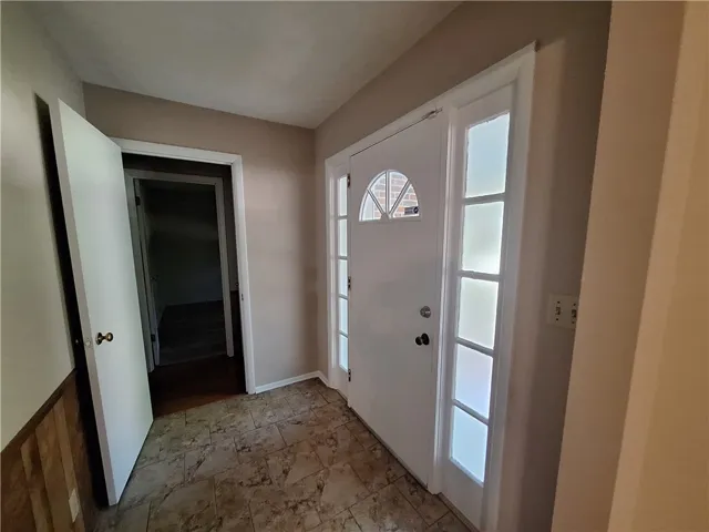 Step into this welcoming entry featuring durable flooring and an inviting ambiance.