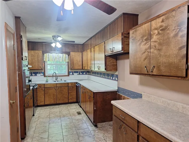 This kitchen offers functional design with ample storage and bright natural light.