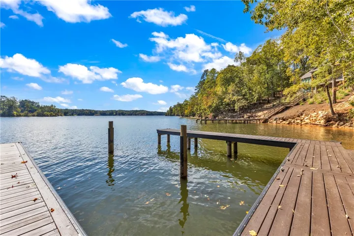 This serene waterfront retreat offers direct access to the lake from its private dock.