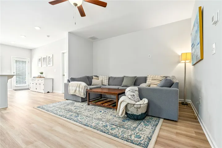 Bright living room with great natural light and easy flow into the kitchen and dining areas.