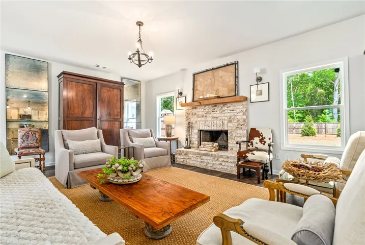 This inviting living space features a cozy fireplace, creating an atmosphere of comfort.