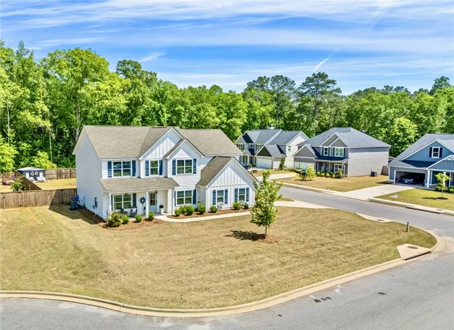 This spacious two-story residence offers classic design in a serene neighborhood setting.