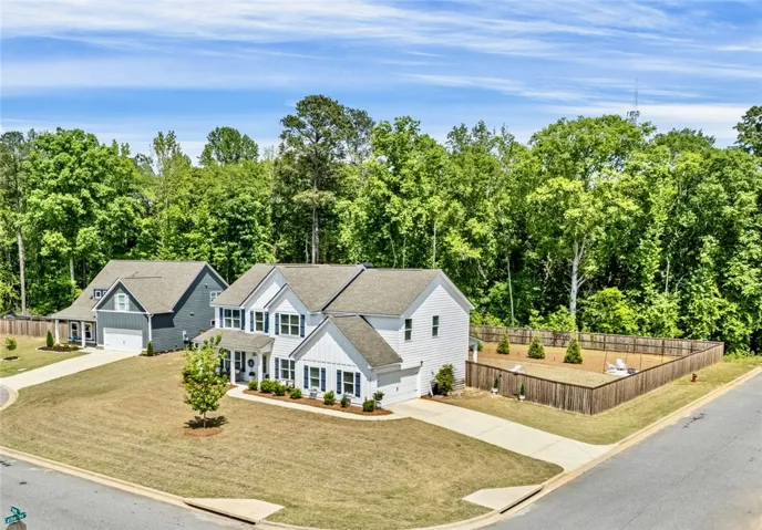 This classic suburban home boasts a large private yard and a spacious driveway.