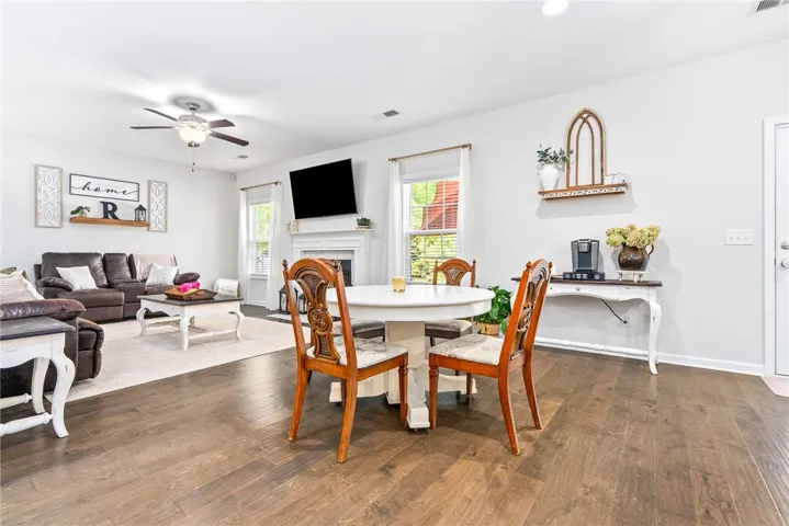 This bright space features elegant hardwood flooring and abundant natural light, perfect for entertaining.