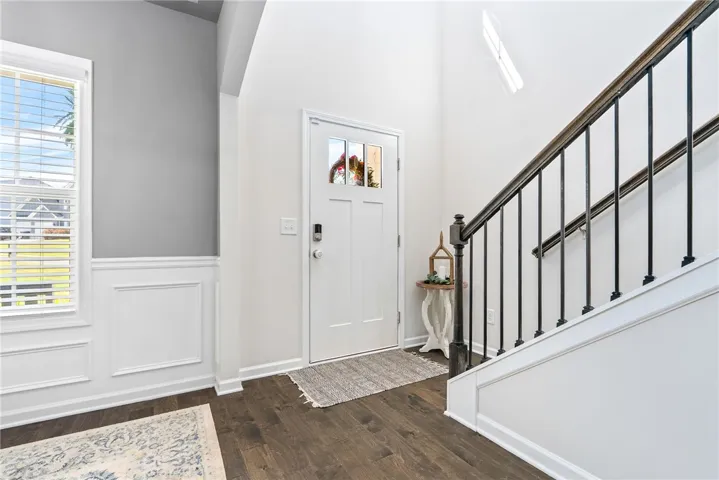 Enter this home and be greeted by high ceilings, rich hardwood flooring, and a grand staircase.