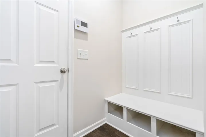 This convenient mud room entry features built-in storage, perfect for organization.