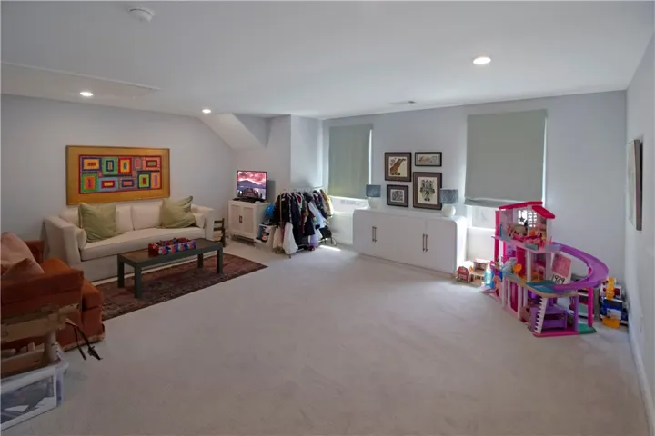 This bright and airy room offers a versatile space, perfect for various uses.