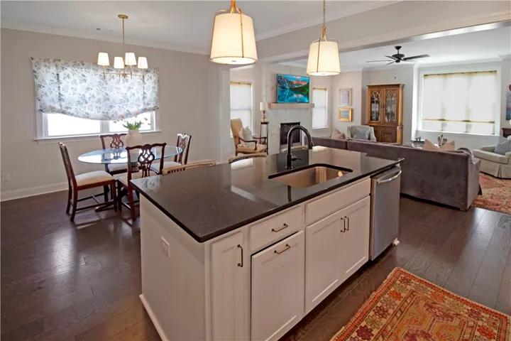 This open concept space seamlessly connects the kitchen, dining, and living areas for modern living.