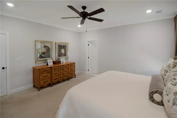 This restful bedroom offers a spacious retreat for comfortable living.