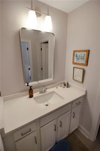 This modern bathroom features clean lines and a functional vanity, offering everyday comfort.