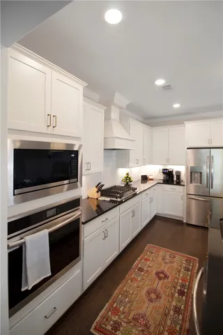 This spacious cooking area features a large island and ample storage, perfect for culinary adventures.