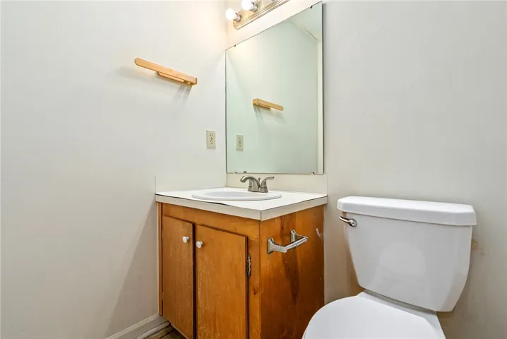 A well-appointed bath features a classic vanity with ample storage beneath a sleek mirror.