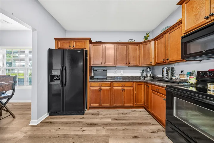 This spacious kitchen offers ample storage and modern amenities, ideal for culinary pursuits.