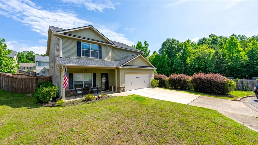 This charming home offers excellent curb appeal and a well-maintained exterior.