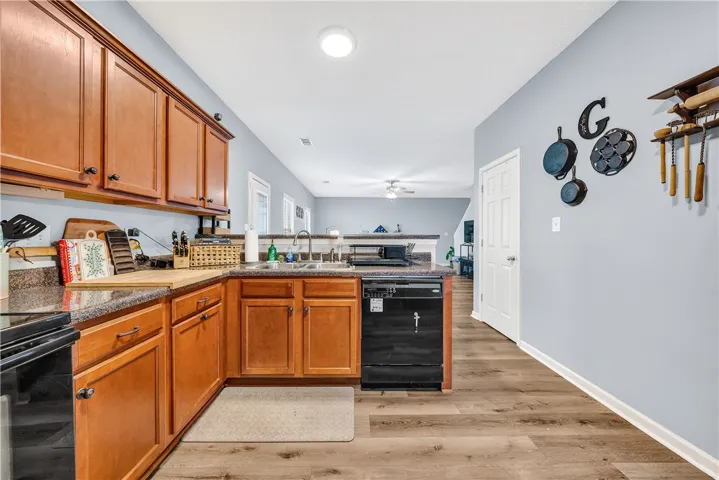 This functional kitchen provides a warm and inviting space for everyday living and culinary pursuits.