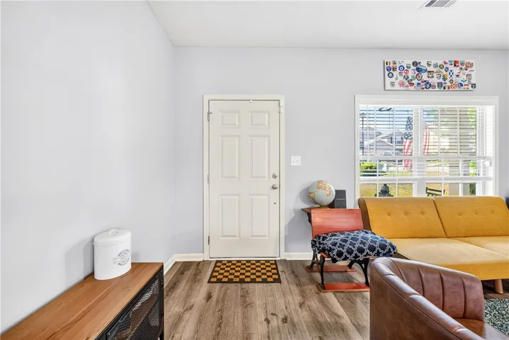 This inviting entryway showcases durable flooring and a window offering natural light.