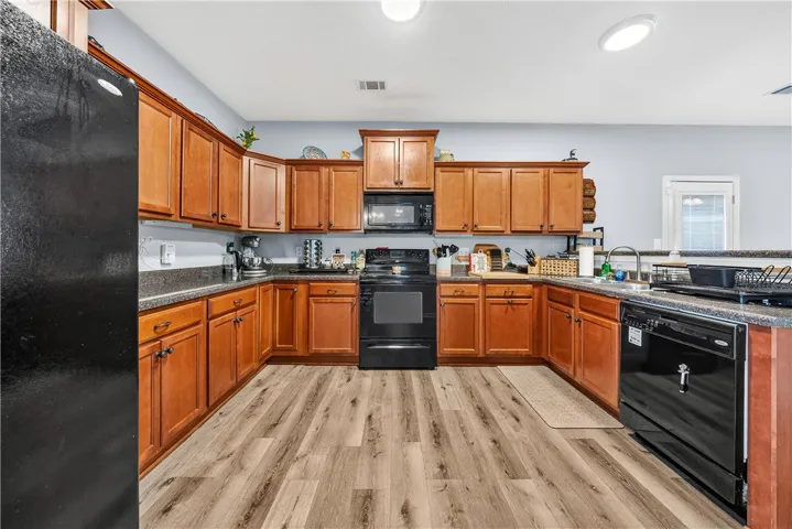 This spacious kitchen offers ample cabinetry and modern appliances, perfect for everyday living.