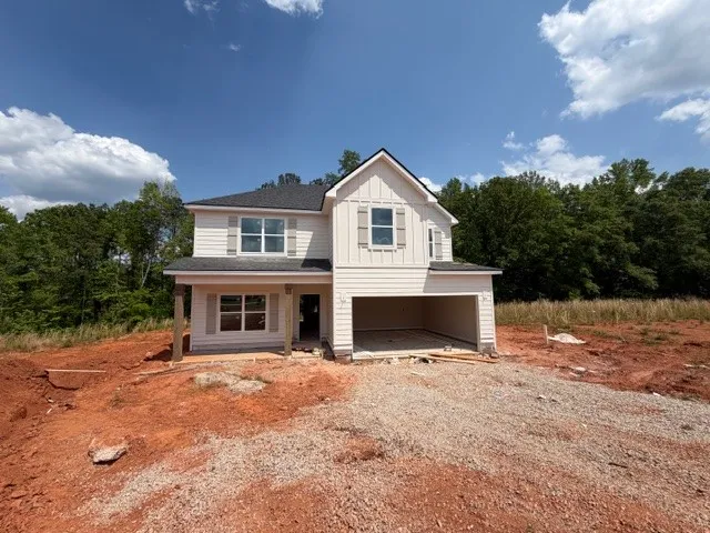This new construction home presents an open canvas for personalized landscaping and outdoor living.