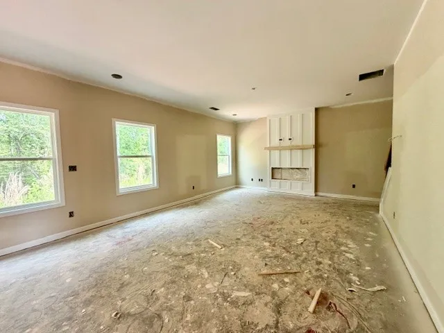 This bright, expansive room awaits your personal touch to create a cherished living space.