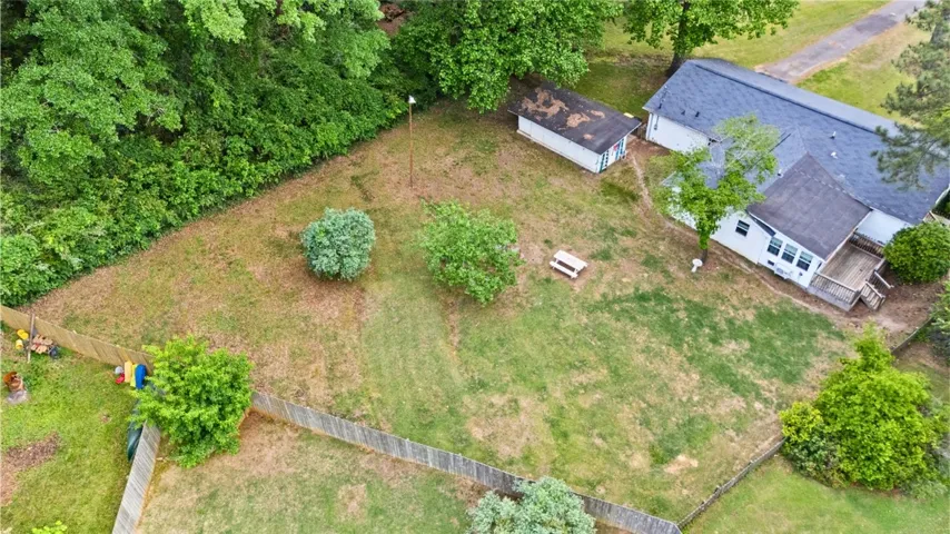 Expansive outdoor living awaits with lush greenery and ample space for recreation and relaxation.