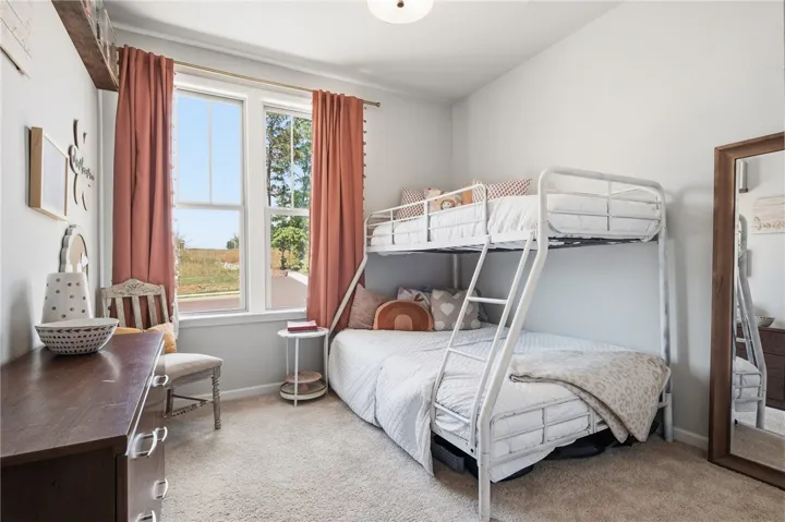 This cozy room offers natural light and comfortable living space.