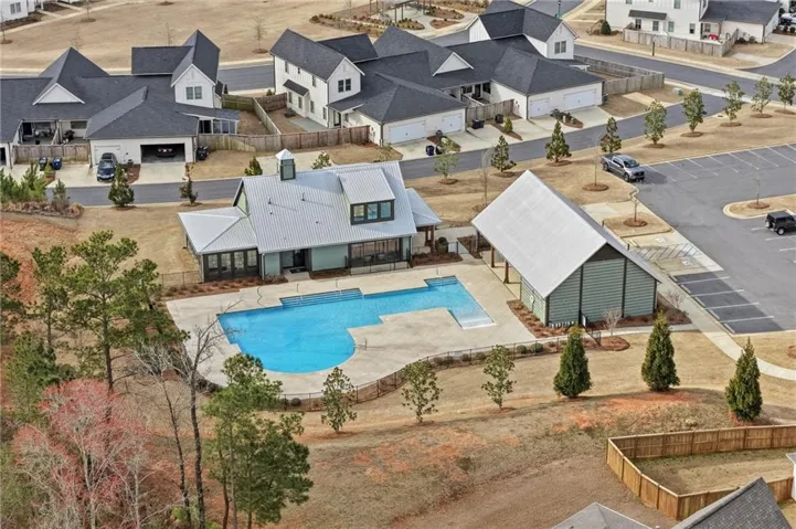 An aerial perspective reveals a serene pool area and community amenities within a well-planned neighborhood.