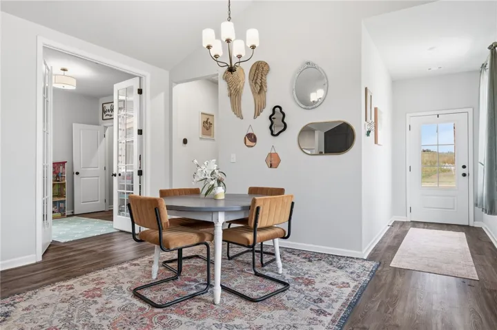 The dining space is convenient to both the kitchen and the living room.