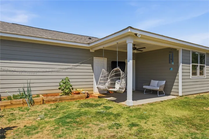 Enjoy outdoor living with a covered patio and a well-maintained yard.