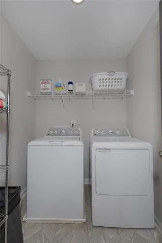 This dedicated laundry area offers practical convenience with essential appliances.