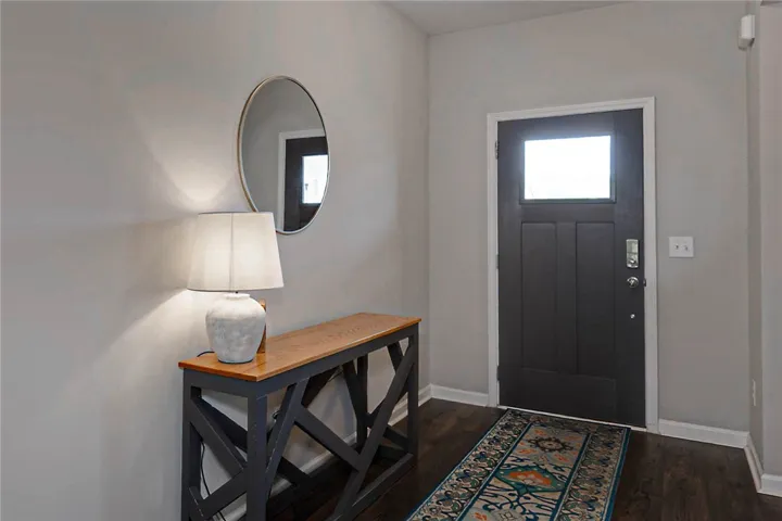 Step inside this inviting entry with warm wood flooring and a welcoming door.