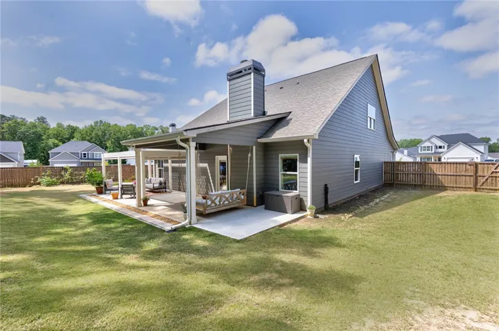 This house features a delightful outdoor space, perfect for entertaining or quiet enjoyment.