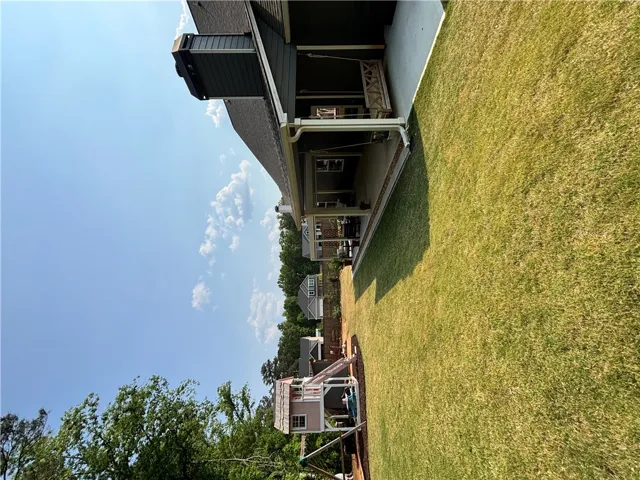 This spacious yard offers ample outdoor living space for recreation and relaxation.