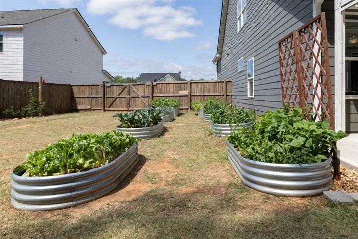 Cultivate your own culinary garden in this expansive private yard.