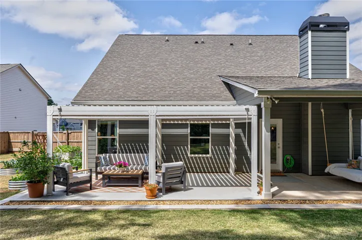 This inviting patio offers a tranquil retreat for outdoor living and entertaining.