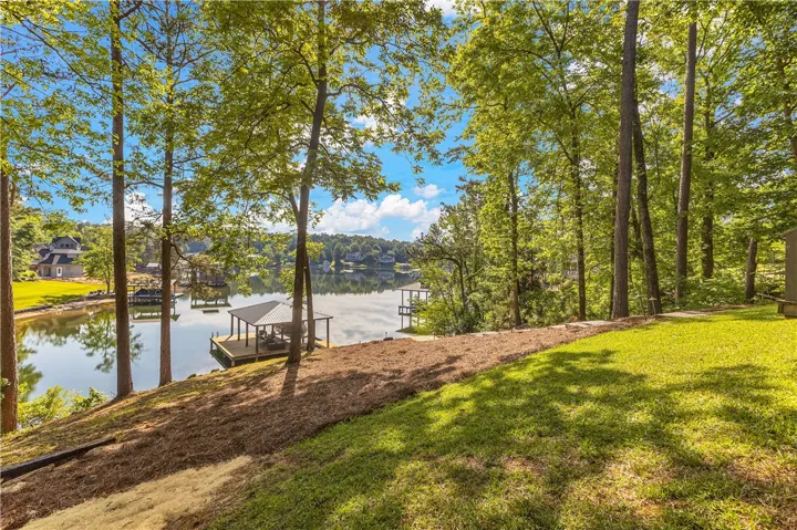This serene waterfront property offers direct lake access and a private dock.