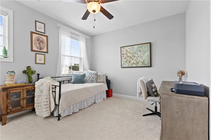 This cozy room offers a serene atmosphere perfect for relaxation or productive work.