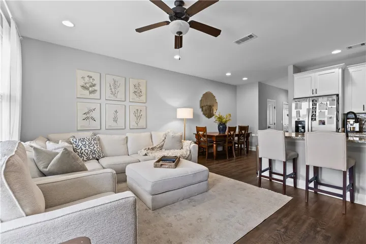 This inviting space combines living, dining, and kitchen areas for seamless daily living.