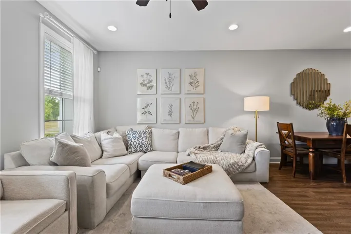 This inviting living area features ample seating and an open flow to the adjacent dining space.