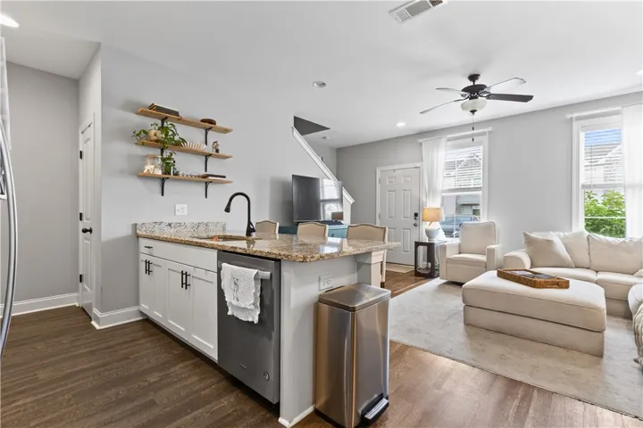 This inviting space combines a modern kitchen and a comfortable living area, perfect for everyday living.