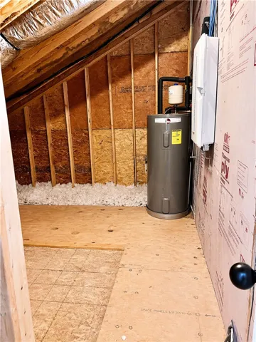 This functional walk-in attic provides convenient access to essential home systems & storage